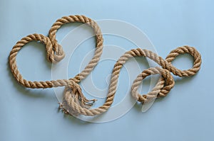 Symbol of a loving heart made of hemp rope