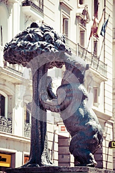 Symbol of Madrid. Statue of Bear and strawberry tree, Puerta del Sol, Spain. photo