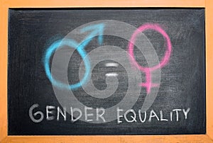 Symbol of male gender is equal to female gender on the blackboard