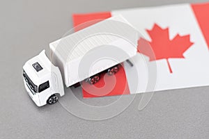 Symbol of National Delivery Truck with Flag of Canada. National Trucking Icon and Canadian flag