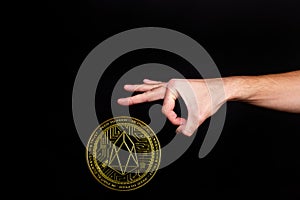 The symbol of the new popular cryptocurrency eosio with the image of hands