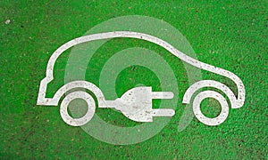 Symbol on the pavement of an electric car charging photo