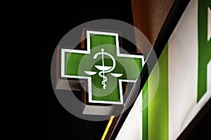 Symbol of pharmaceuticals and pharmacies in European countries green cross photo