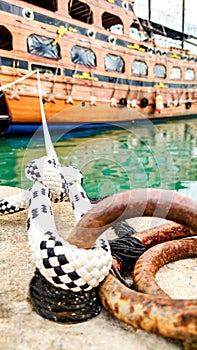 Symbol of Safety, Large Old Ship Moored at Dock with Mooring Knot, Close-Up.