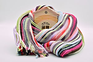 Wooden house sheltered with a scarf photo