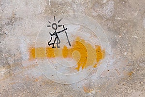 Symbol of the Way of Saint James, or Camino de Santiago, with a yellow arrow and a pilgrim on it photo