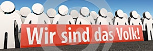 A symbol image with figurs and banner: We are the poeple! `Wir sind das Volk!` in German photo