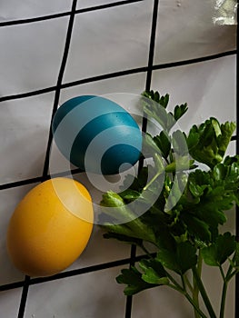 Yellow and blue Easter egg on the table