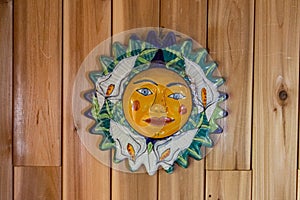 Symbolic & cultural sun face wall art.