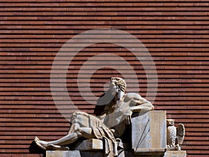 symbolic figure with owl on the facade