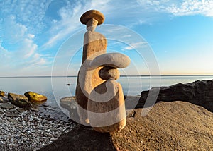 Symbolic figurines on seashore