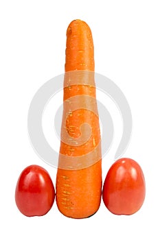 Symbolic phallic concept image of carrot and two tomatoes