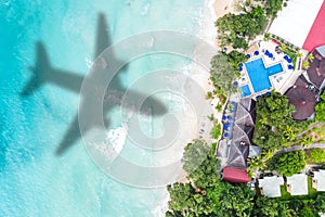 Symbolic picture vacation travel traveling luxury villa sea airplane flying Seychelles aerial photo beach
