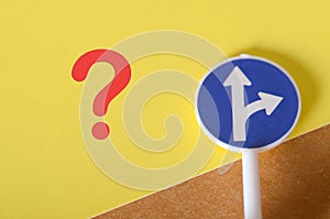 Symbolic Road Choices: Question Mark and Direction Sign Representing Uncertainty
