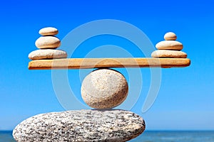 Concept of harmony and balance. Balance stones against the sea. photo