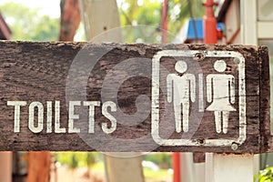 Symbolize toilets on the wooden floor.