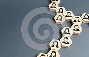 Symbols of employees on the chains of hexagons. The concept of business connections. Team building, business organization