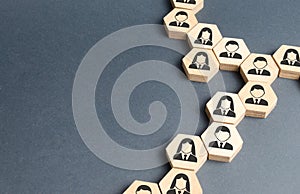 Symbols of employees on the chains of hexagons. The concept of business connections. Team building, business organization photo