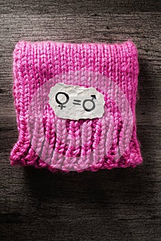 Symbols for gender equality, on a pink hat