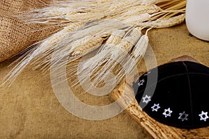 Symbols of jewish holiday Shavuot torah and shofar wooden background