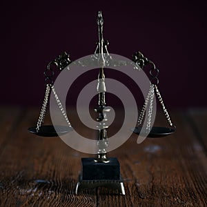 Symbols of law and justice. Dark rustic background