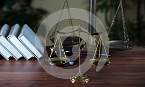 Symbols of law and justice on table. rustical background