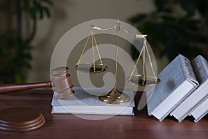 Symbols of law and justice on table. rustical background