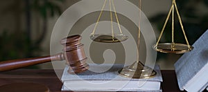 Symbols of law and justice on table. rustical background