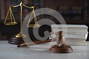 Symbols of law and justice on table. rustical background