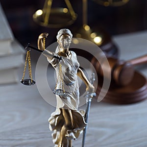 Symbols of law and justice on table. rustical background