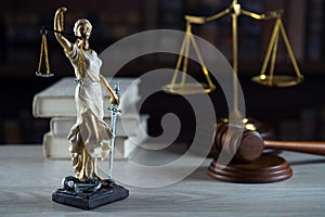 Symbols of law and justice on table. rustical background