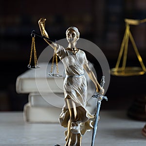 Symbols of law and justice on table. rustical background