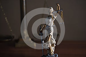 Symbols of law and justice on table. rustical background