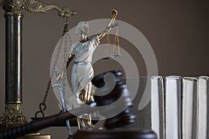 Symbols of law and justice on table. rustical background