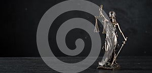 Symbols of law and justice on table. rustical background