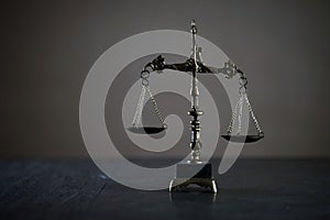 Symbols of law and justice. Themis. Dark rustic background