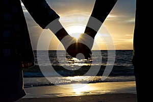 Symbols of love. silhouette Couple of man and woman hand holding