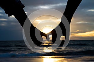 Symbols of love. silhouette Couple of man and woman hand holding