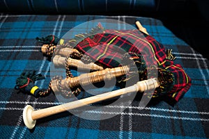 Symbols of Scotland - wollen tartan textile and handmade musical instrument bagpipes