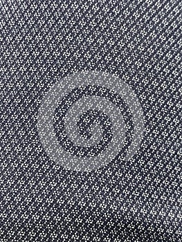Symetrical cloth pattern with grey and white colored thread