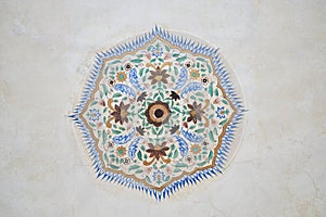 symetrical floral ornament on a ceiling in Amber Palace in Jaipur, Rajasthan, India