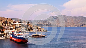 Symi town, Symi island, pictorial view of colorful houses and Yialos harbour