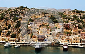 Symi town, Symi island, pictorial view of colorful houses and Yialos harbour