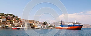 Symi town, Symi island, pictorial view of colorful houses and Yialos harbour