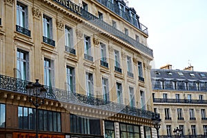 Symmetric architecture and tiny long balconies in Paris
