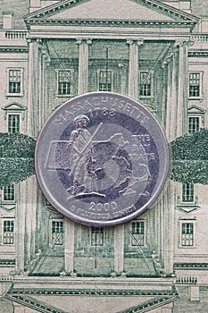 Symmetric composition of US dollar bills and a quarter of Massachusetts