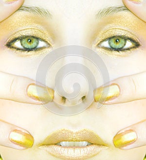 Symmetric gold face of woman photo
