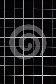 Symmetric metal grid on black background