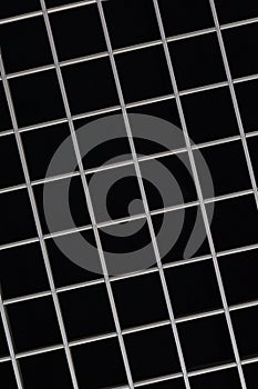 Symmetric metal grid on black background