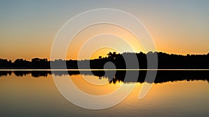 Symmetric reflections on calm lake